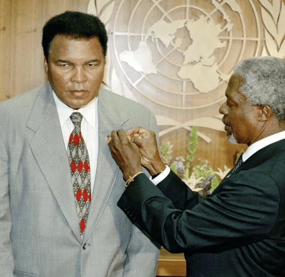 Photo of Muhammad Ali receiving UN Messenger of Peace pin from Secretary-General Kofi Annan