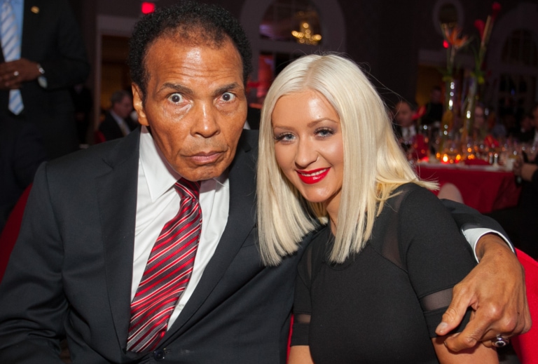 Muhammad Ali posing with Christina Aguilera