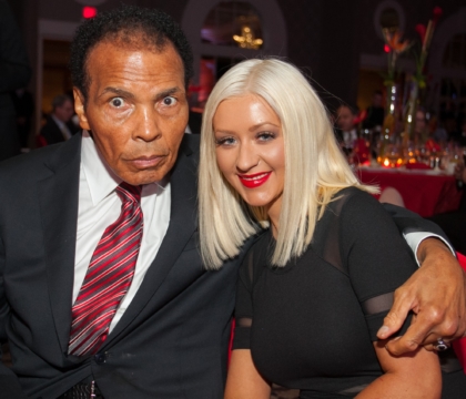 Muhammad Ali posing with Christina Aguilera