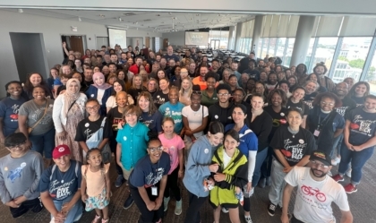Picture of group of volunteers and staff inside the Muhammad Ali Center