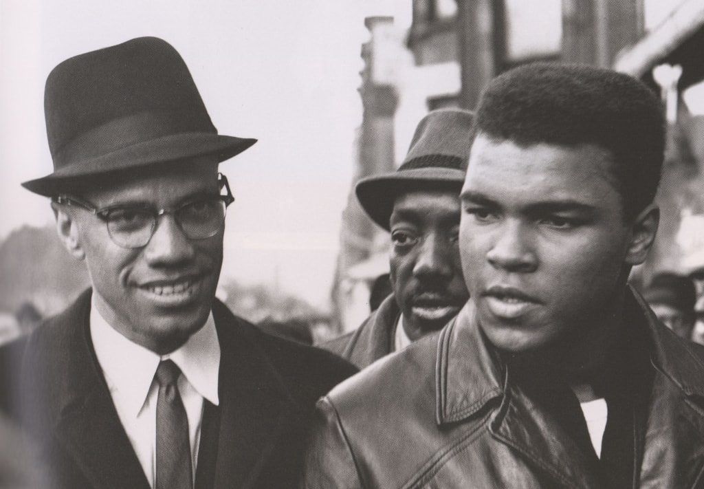 Black and white photo of Muhammad Ali and Malcolm X