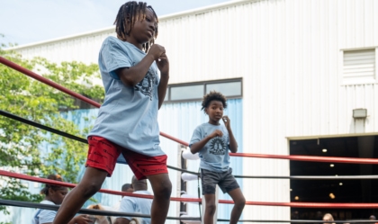 Photo of children inside boxing ring with fighting poses