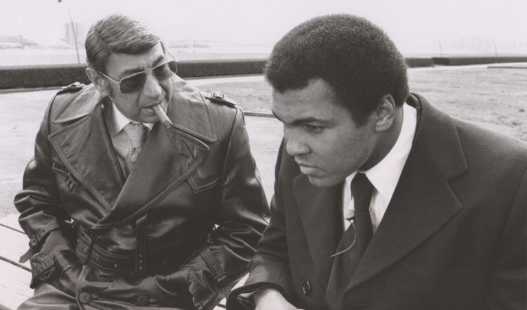 Black and white photo of Muhammad Ali and Howard Cosell