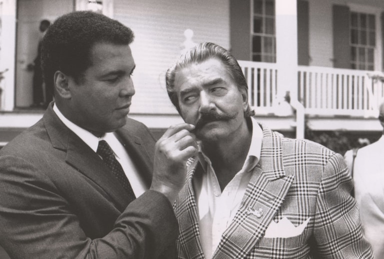 Black and white photo of Muhammad Ali and Leroy Nieman