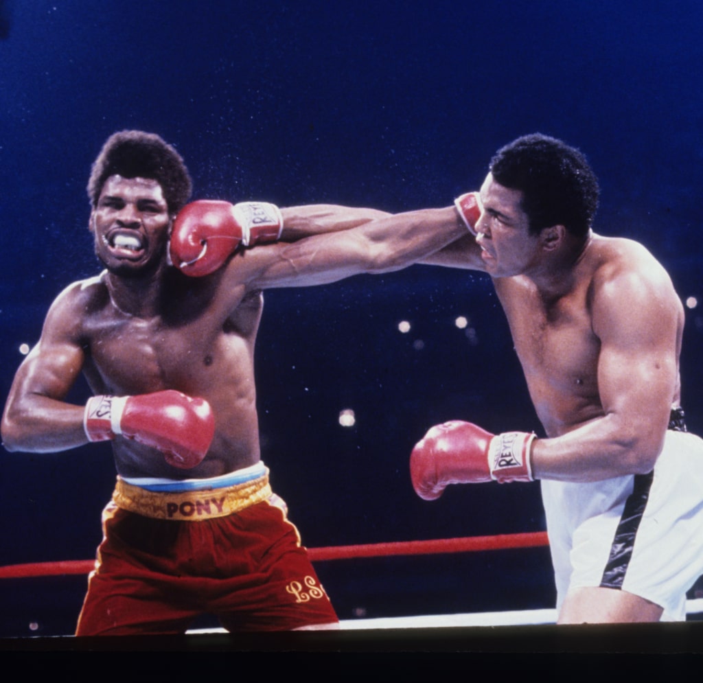 Action photo of Muhammad Ali trading punches with Leon Spinks