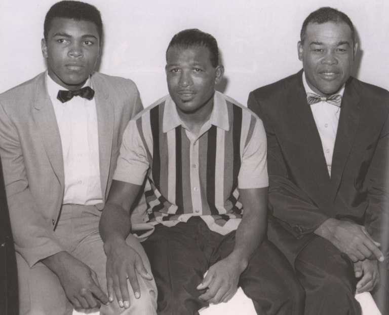 Black and white photo of Muhammad Ali, Sugar Ray Robinson, and Joe Louis