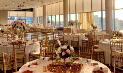 View of View Pointe Hall set up for a wedding with large round tables and chairs