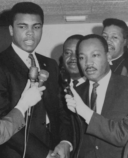 Black and white photo of Muhammad Ali with Martin Luther King, Jr.