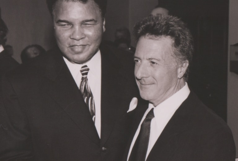 Muhammad Ali standing next to Dustin Hoffman