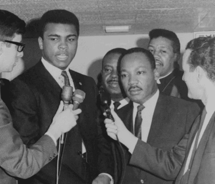 Black and white photo of Muhammad Ali with Martin Luther King, Jr.