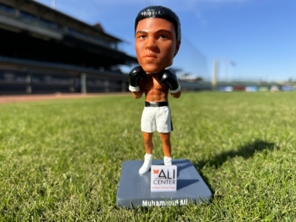 Picture of Muhammad Ali bobblehead standing on baseball field