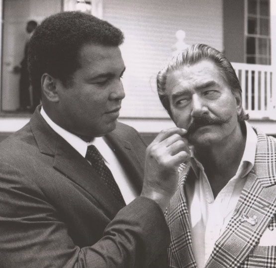 Black and white photo of Muhammad Ali and Leroy Nieman