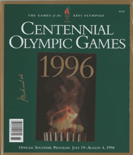 Green souvenir program for the 1996 Summer Games featuring picture of Olympic flame