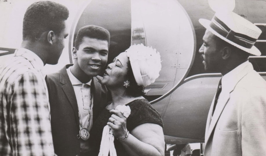 Picture of Muhammad Ali, his brother, mom and dad near plane