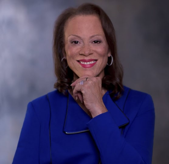 Lonnie Ali standing in a blue jacket