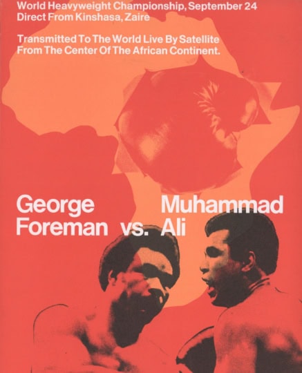 Red and orange poster featuring images of Ali and Foreman and outline of Africa with text "George Foreman v. Muhammad Ali"