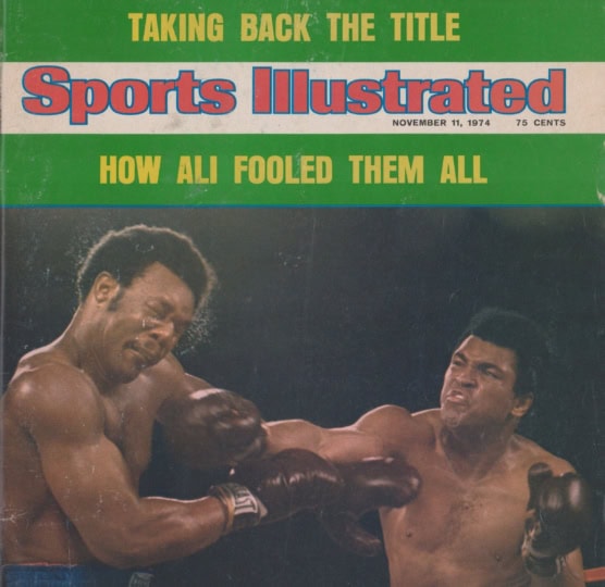 Photo of Sports Illustrated cover with image of Muhammad Ali and George Foreman in boxing ring with Ali throwing punch at Foreman