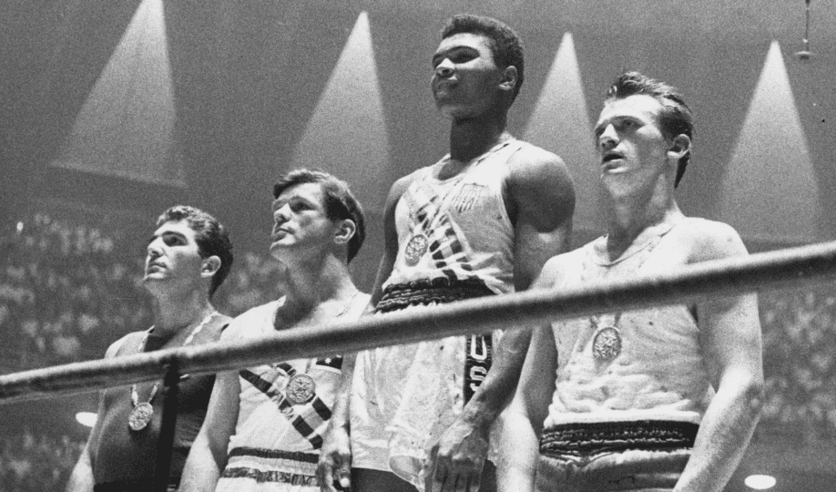 Picture of Muhammad Ali and three other boxers standing inside boxing ring