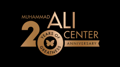 Muhammad Ali Center logo embossed in bronze featuring "20 years of greatness" design