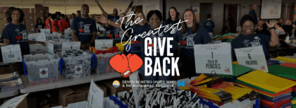 Photo of volunteers with hands raised in excitement and "The Greatest Give Back" logo superimposed on top