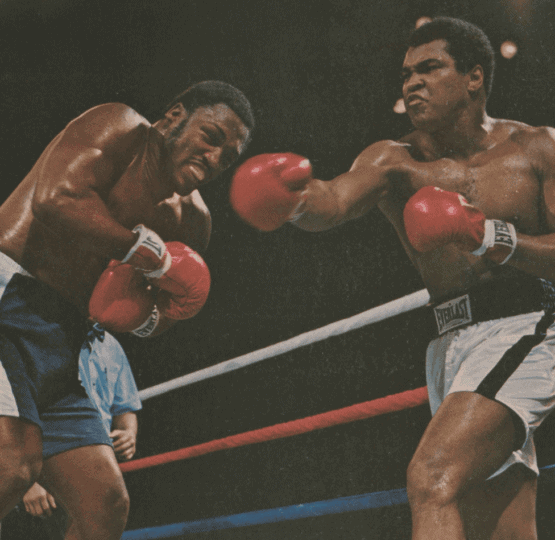 Sports Illustrated cover depicting Ali and Frazier in the ring with Ali throwing punch