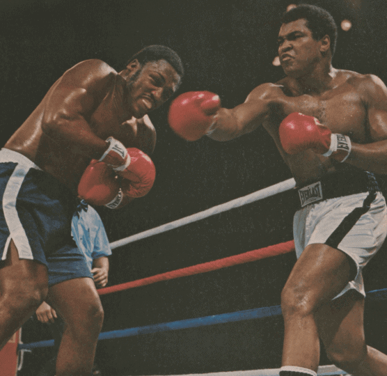 Sports Illustrated cover depicting Ali and Frazier in the ring with Ali throwing punch
