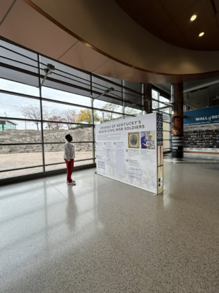 Man looking at signage in lobby highlighting Civil War history