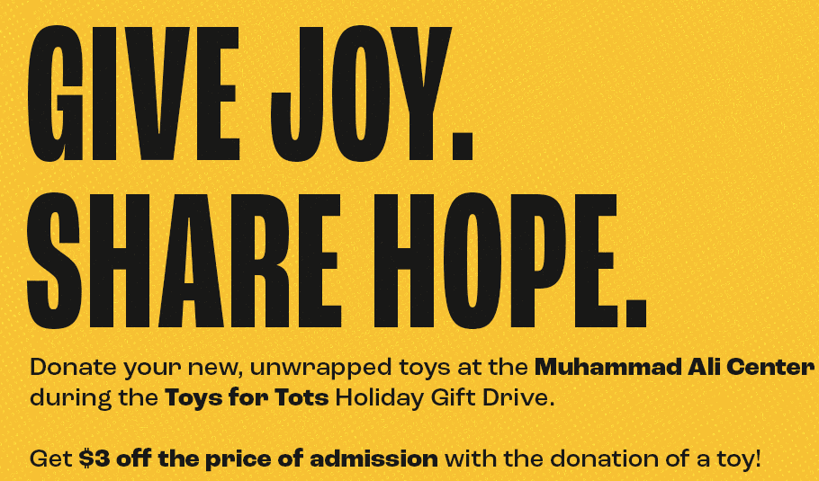 Photo of Muhammad Ali holding child while looking forward on orange backdrop, featuring Toys for Tots logo and text "Give Joy. Share Hope."