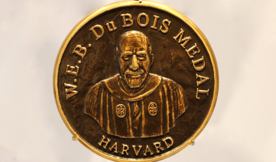 Gold Medal featuring image of W.E.B. DuBois and text "W.E.B. DuBois Medal, Harvard"