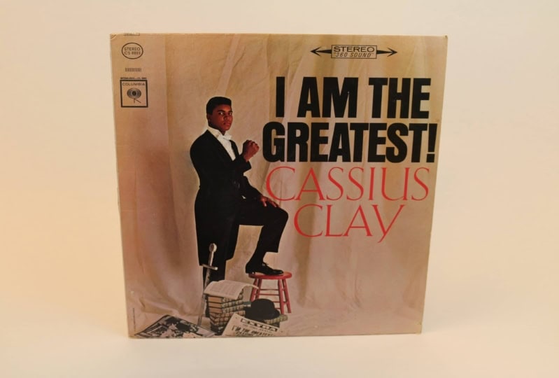 Album cover featuring Muhammad Ali in suit on brown backdrop with text "I Am the Greatest!"