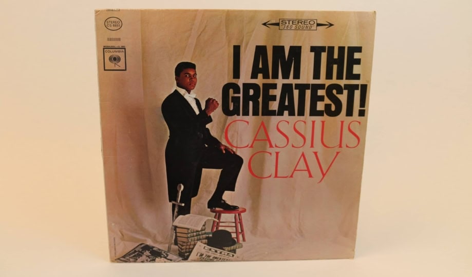 Album cover featuring Muhammad Ali in suit on brown backdrop with text "I Am the Greatest!"