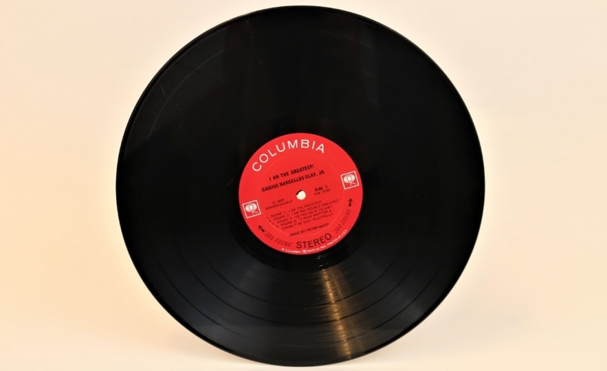 Vinyl record with red sticker label and 'I Am The Greatest" text