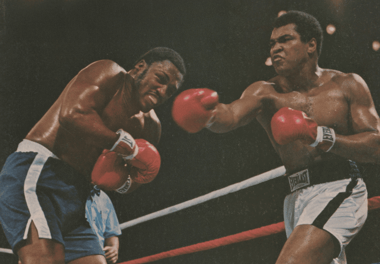Sports Illustrated cover depicting Ali and Frazier in the ring with Ali throwing punch