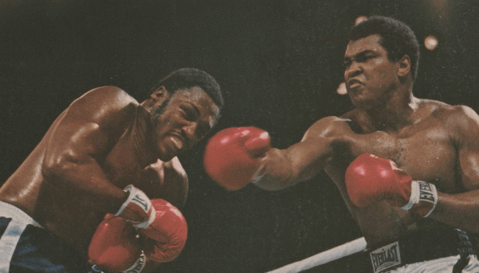 Sports Illustrated cover depicting Ali and Frazier in the ring with Ali throwing punch