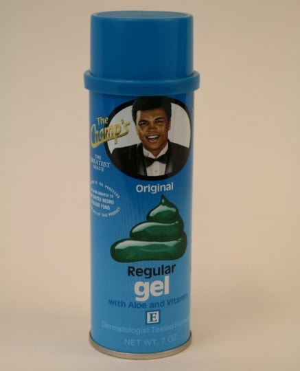 Blue can of The Champ's shaving gel featuring Muhammad Ali's picture