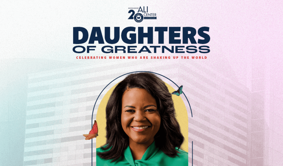 Daughters of Greatness logo with image of woman with shoulder-length dark hair wearing green shirt smiling at camera