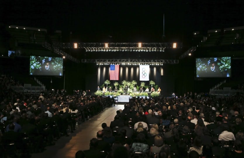 Wide shot of auditorium hosting memorial service