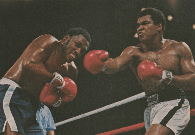 Sports Illustrated cover depicting Ali and Frazier in the ring with Ali throwing punch