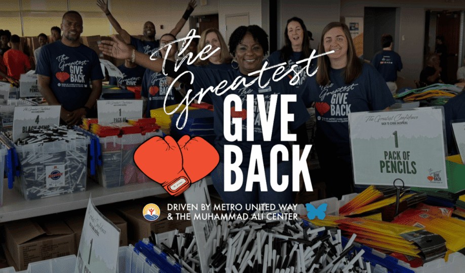 Photo of volunteers with hands raised in excitement and "The Greatest Give Back" logo superimposed on top